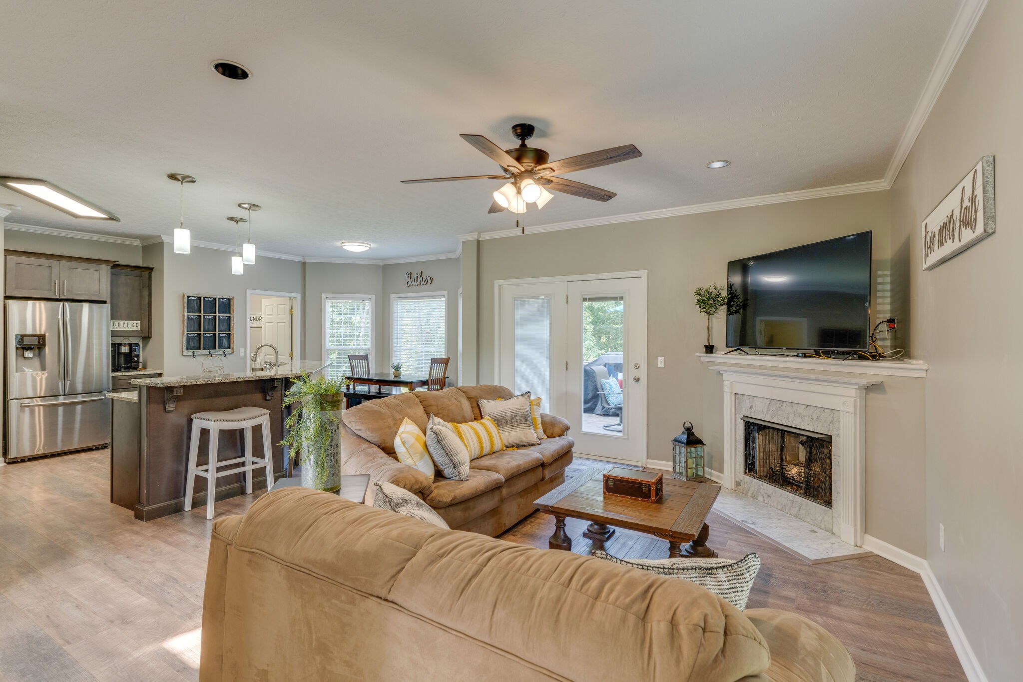 2754 Gideon Road Greenbrier, TN 37073 - Photo 8 of 45 a living room with furniture a flat screen tv and a fireplace