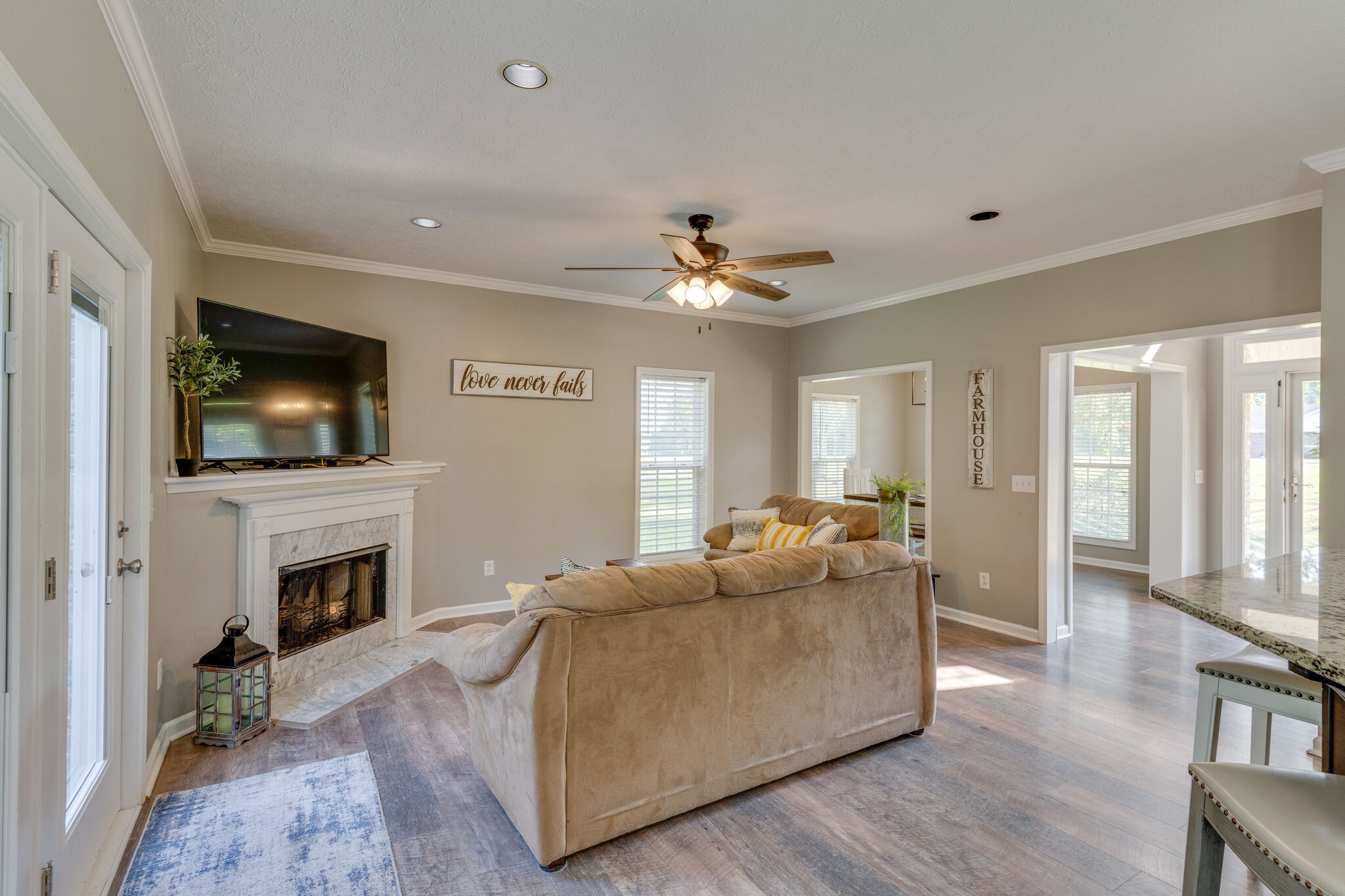 2754 Gideon Road Greenbrier, TN 37073 - Photo 9 of 45 a living room with furniture a flat screen tv and a fireplace