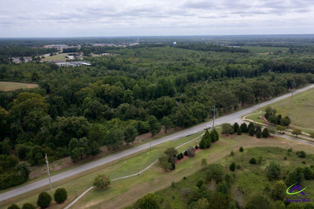 Airport Road Perry, GA 31069 - Photo 4 of 23 an aerial view of a residential houses with outdoor space and trees