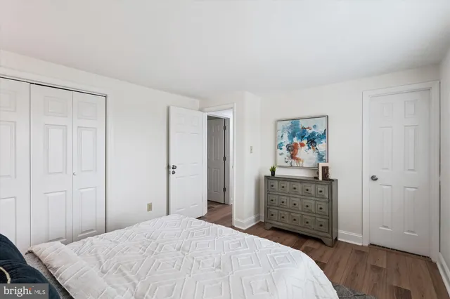a bedroom with a bed and a cabinets
