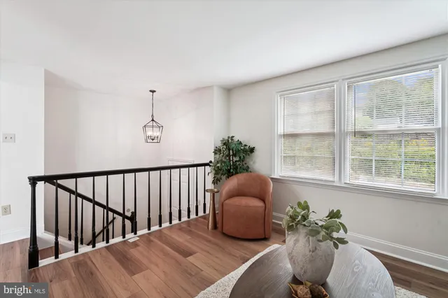 a bed room with furniture and a window