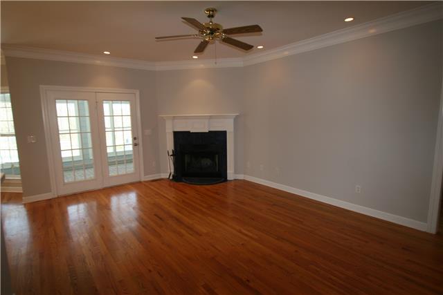 1560 Short Springs Road Tullahoma, TN 37388 - Photo 11 of 18 The living room has a fireplace and has a doorway out to the sun porch.