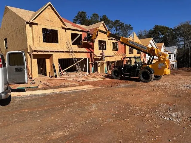 a view of a house with large trees
