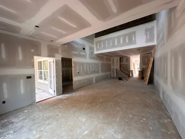 a view of an empty room with a fireplace