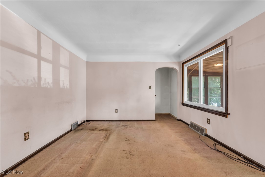 12931 Fruitside Road Garfield Heights, OH 44125 - Photo 6 of 15 Unfurnished room featuring light carpet