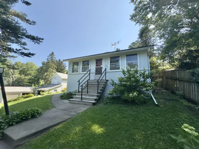 front view of a house with a yard