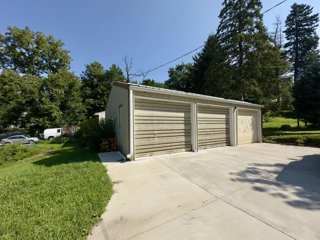 a backyard of a house with lots of green space