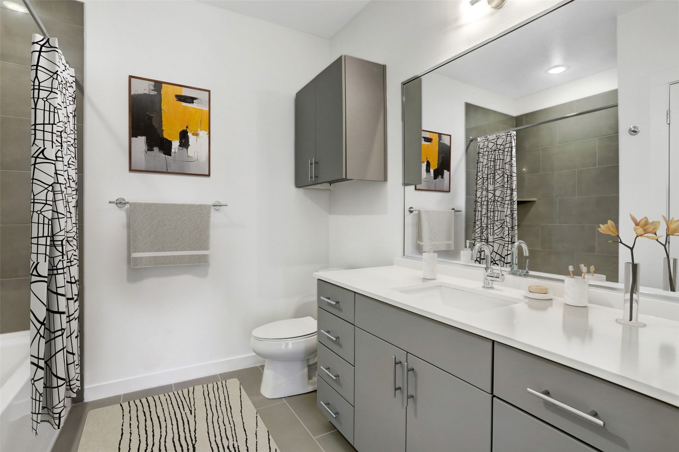 4801 Springdale Road, Unit 2309 Austin, TX 78723 - Photo 12 of 15 Featuring modern finishes and direct access from the second bedroom, this private bathroom gives guests or roommates their own dedicated space to refresh and unwind