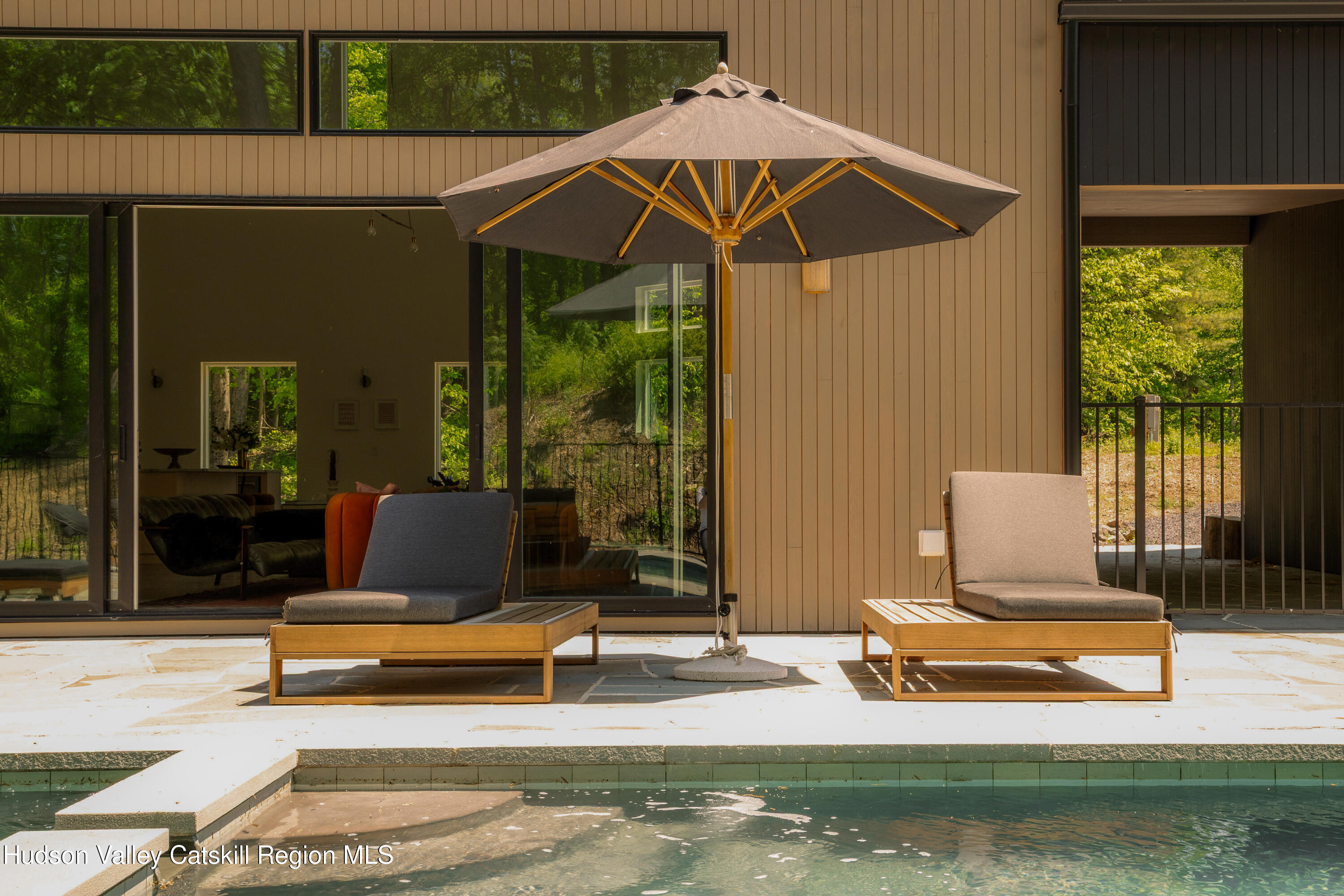54 Langridge Road Tivoli, NY 12583 - Photo 21 of 40 a view of a patio with a table and chairs under an umbrella