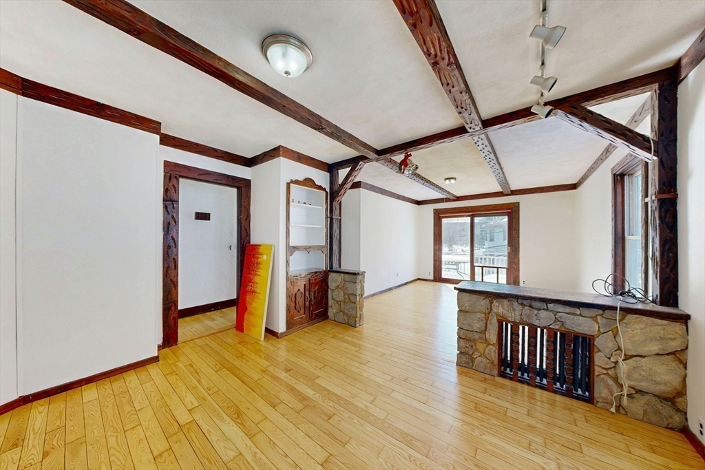 5 Alcott Street Boston, MA 02134 - Photo 14 of 36 a view of a hallway with wooden floor and staircase