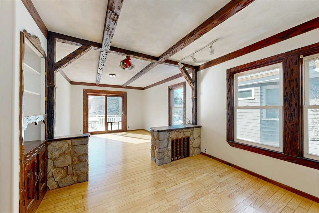 5 Alcott Street Boston, MA 02134 - Photo 15 of 36 a view of an empty room with window and wooden floor