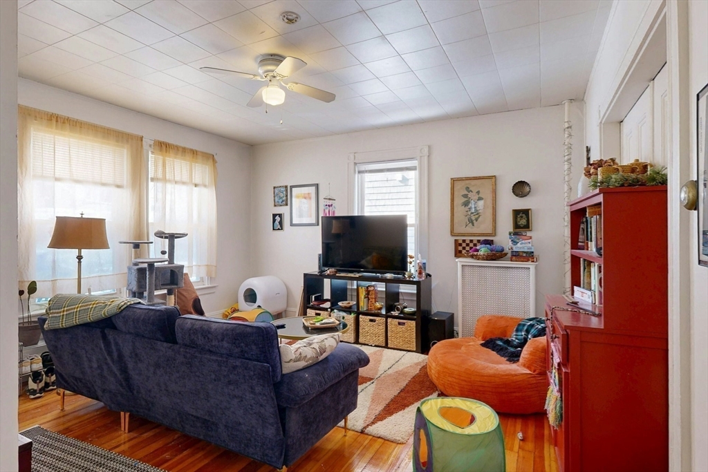 5 Alcott Street Boston, MA 02134 - Photo 26 of 36 a living room with furniture and a flat screen tv