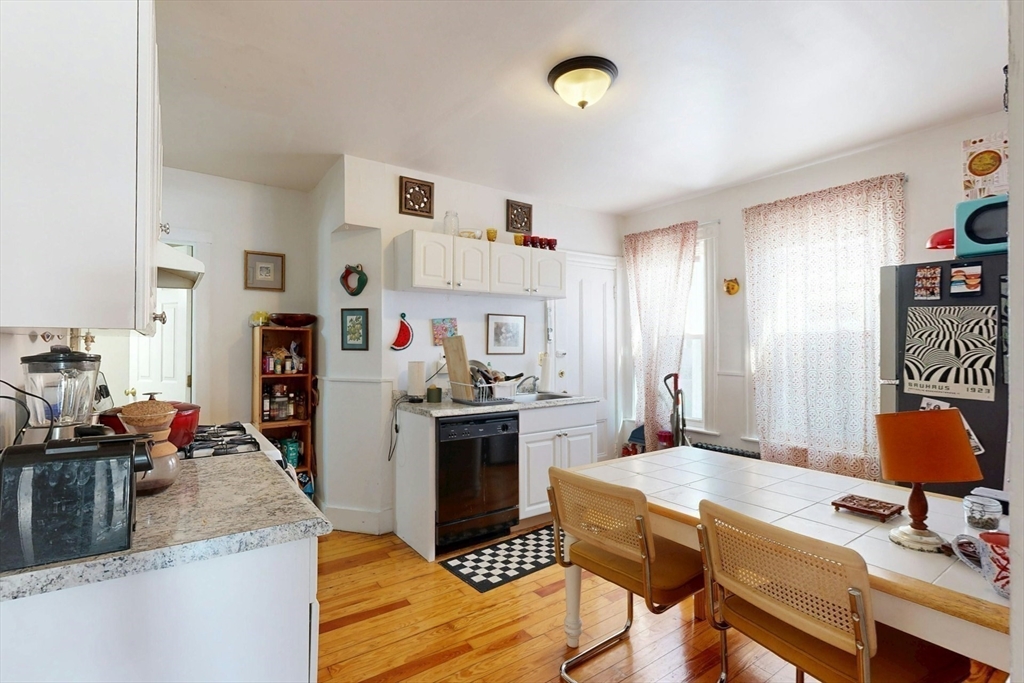 5 Alcott Street Boston, MA 02134 - Photo 29 of 36 a kitchen with a refrigerator stove and sink