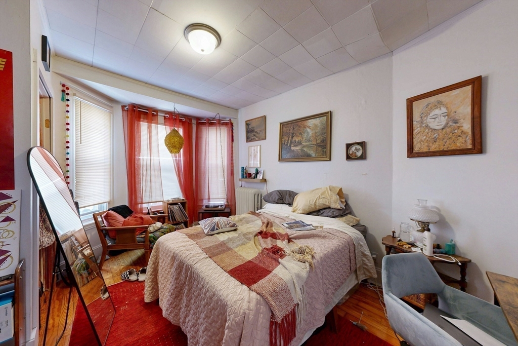 5 Alcott Street Boston, MA 02134 - Photo 30 of 36 a bedroom with bed and a window
