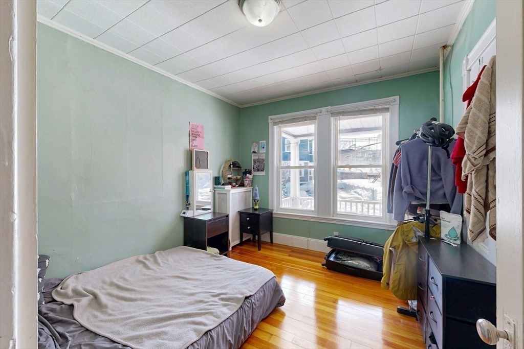 5 Alcott Street Boston, MA 02134 - Photo 33 of 36 a bedroom with furniture and a window
