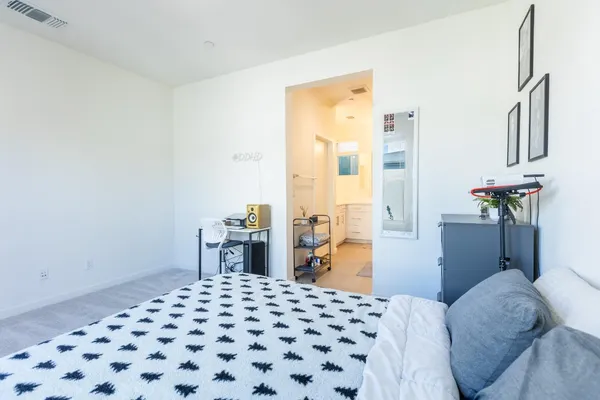 a bedroom with a bed and a cabinets
