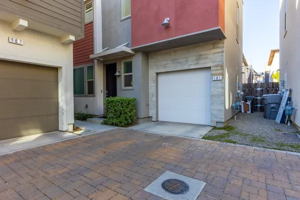 a view of a patio with table and chairs
