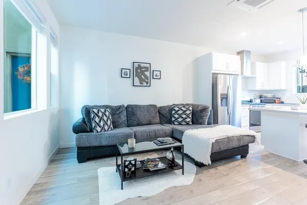 a bedroom with a bed couch and a window