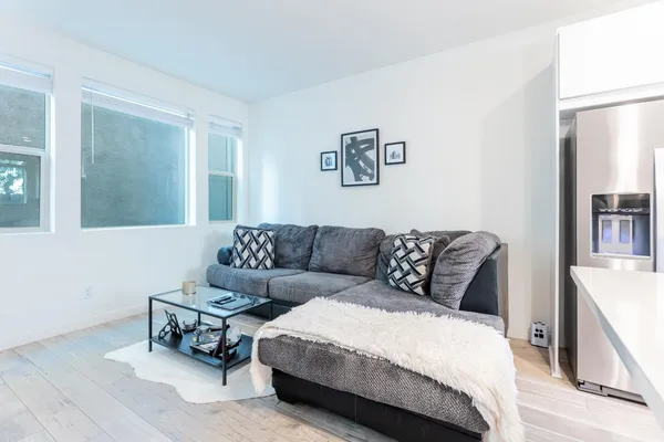 a living room with a couch and a window