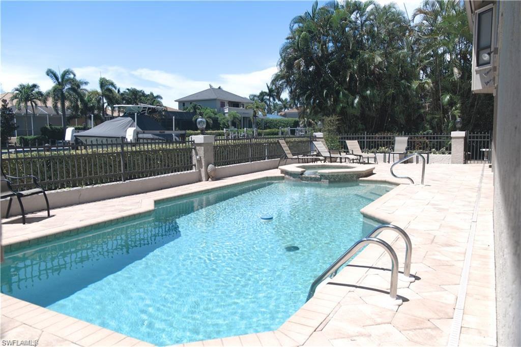 a view of a swimming pool with a patio
