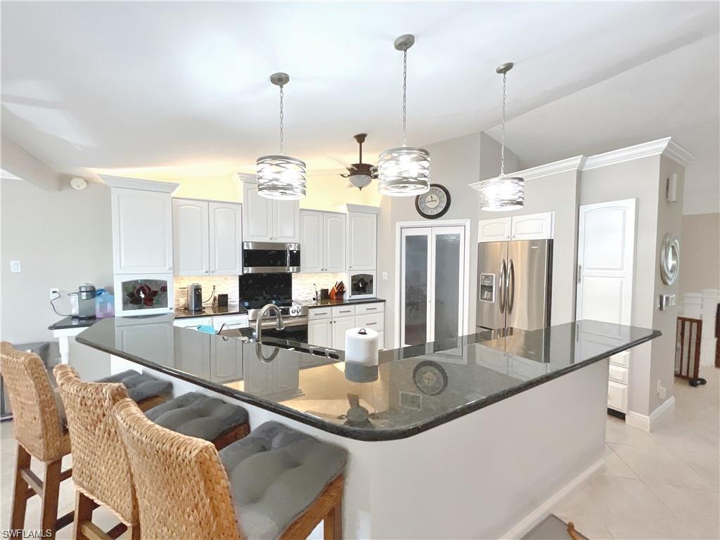 110 June Court Marco Island, FL 34145 - Photo 8 of 31 a very nice looking dining room with a table and chairs