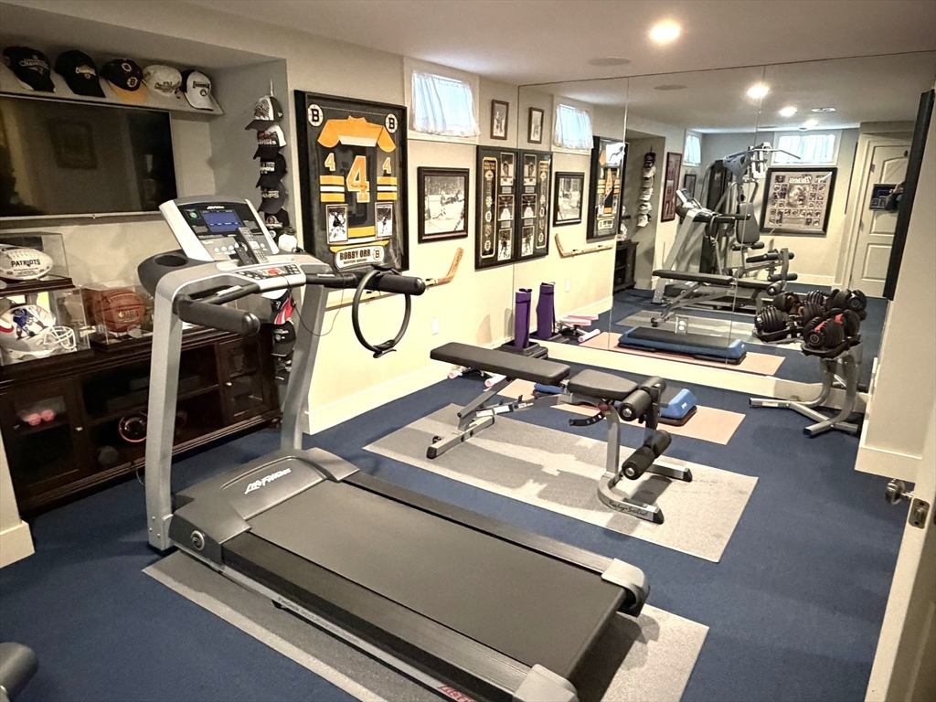 4 Tamarack Lane Sandwich, MA 02563 - Photo 38 of 42 a room with gym equipment and a flat screen tv