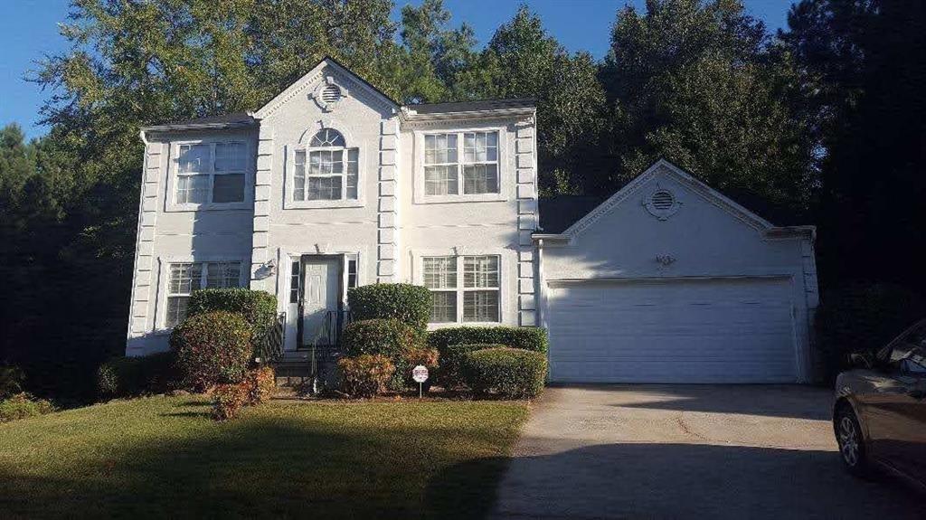 3185 Kings Glen Trail Decatur, GA 30034 - Photo 1 of 9 a front view of a house with a yard and garage