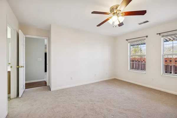 a spacious bathroom with a double vanity sink double and mirror