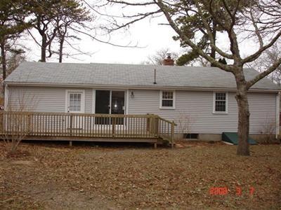 Undisclosed Address Harwich, MA 02645 - Photo 5 of 9 a view of a house with a yard