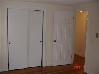 Undisclosed Address Harwich, MA 02645 - Photo 7 of 9 a view of a hallway with wooden floor