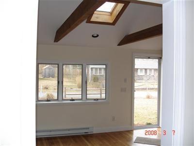 Undisclosed Address Harwich, MA 02645 - Photo 8 of 9 a living room with a large window