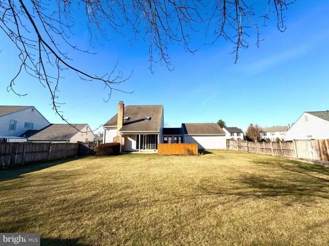 a view of a swimming pool with lawn chairs