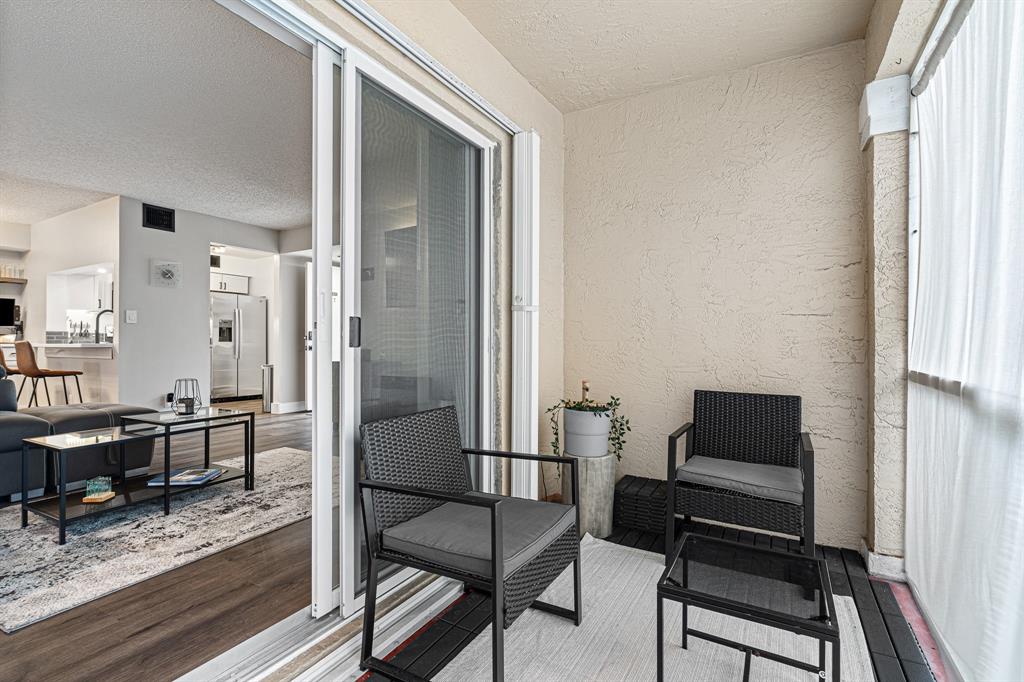 4620 West McNab Road, Unit B1 Pompano Beach, FL 33069 - Photo 26 of 36 a living room with furniture and a window