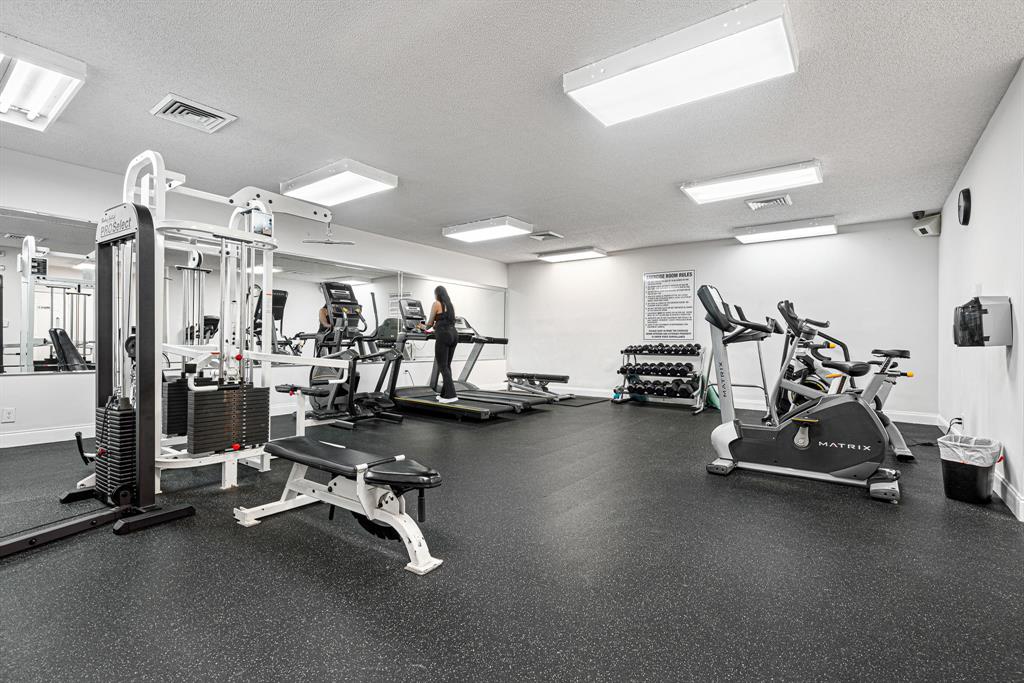 4620 West McNab Road, Unit B1 Pompano Beach, FL 33069 - Photo 31 of 36 a view of a room with gym equipment
