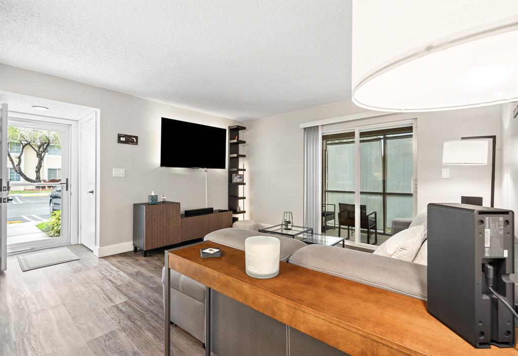 4620 West McNab Road, Unit B1 Pompano Beach, FL 33069 - Photo 5 of 36 a view of a living room and dining room