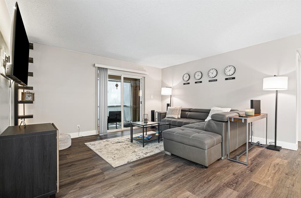 4620 West McNab Road, Unit B1 Pompano Beach, FL 33069 - Photo 7 of 36 a living room with furniture and a flat screen tv