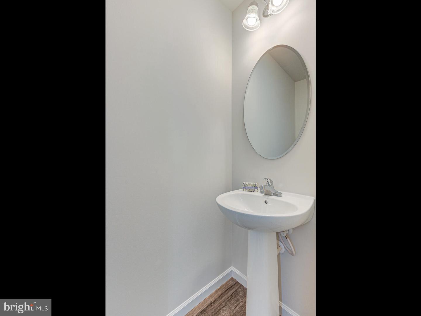 290 Sage Circle Winchester, VA 22603 - Photo 13 of 31 a bathroom with a sink and a mirror