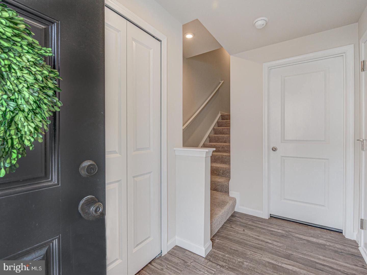 290 Sage Circle Winchester, VA 22603 - Photo 2 of 31 an empty room with wooden floor staircase and windows