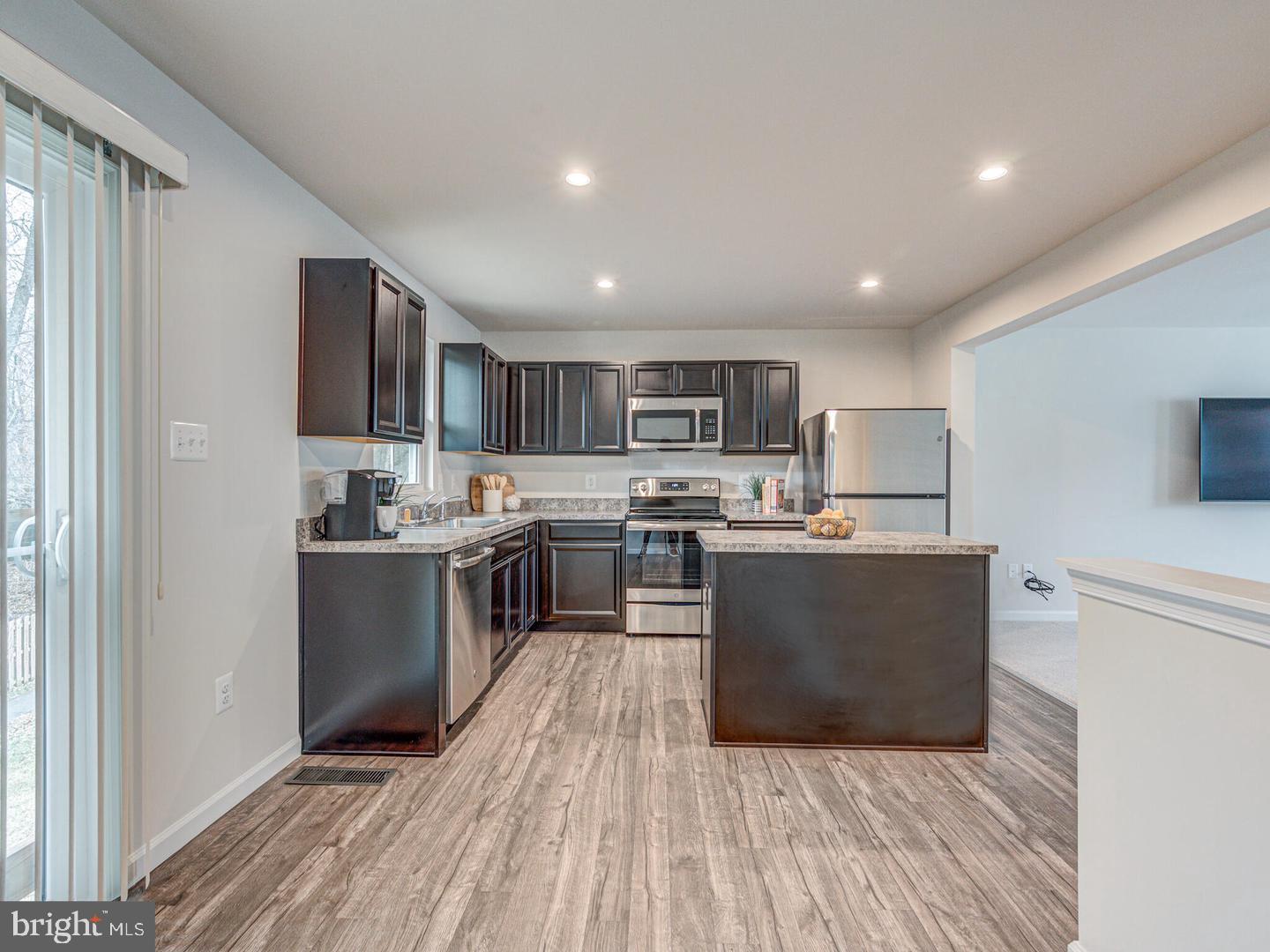 290 Sage Circle Winchester, VA 22603 - Photo 7 of 31 a large kitchen with lots of counter space and stainless steel appliances