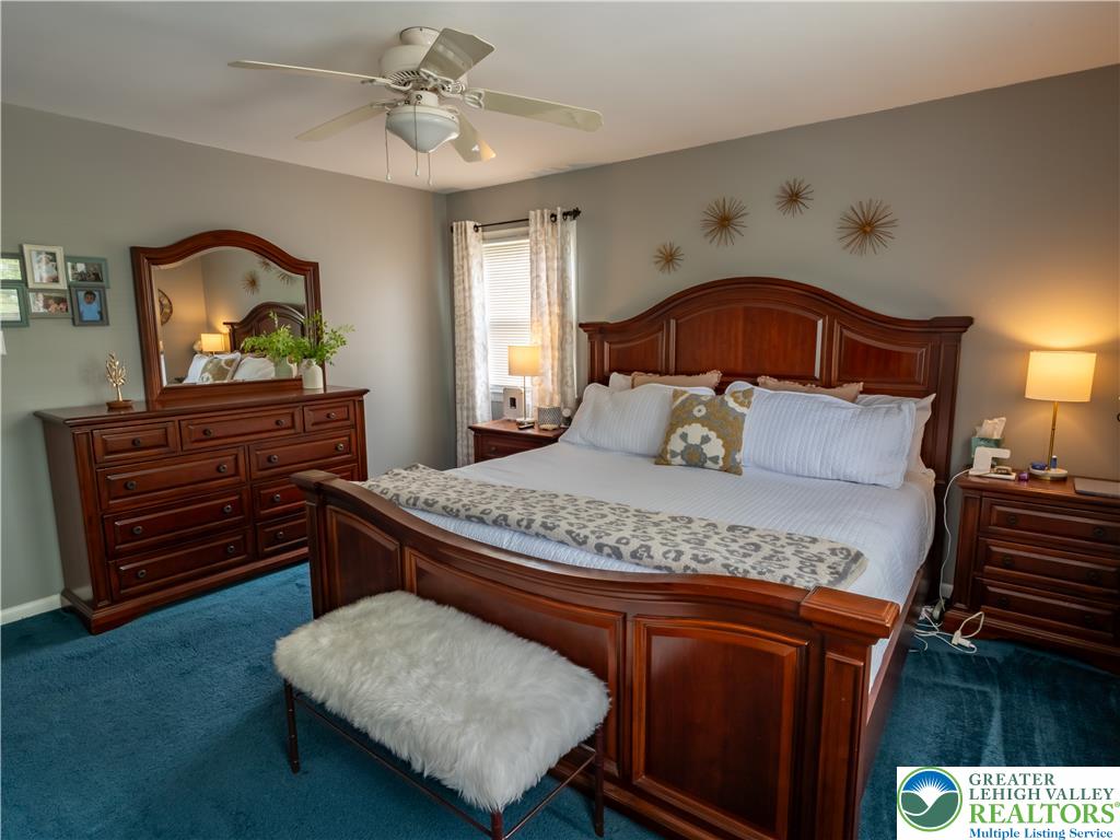 2087 Hopewell Road Bethlehem, PA 18017 - Photo 24 of 38 A restful bedroom offers a cozy ambiance with rich wooden furniture and soft carpet underfoot.
