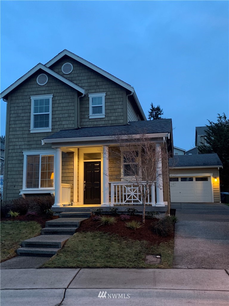 662 Lyons Avenue Northeast Renton, WA 98059 - Photo 1 of 28 a front view of a house with garden