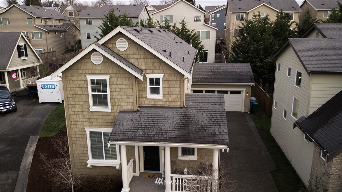 662 Lyons Avenue Northeast Renton, WA 98059 - Photo 2 of 28 a front view of a house with a yard