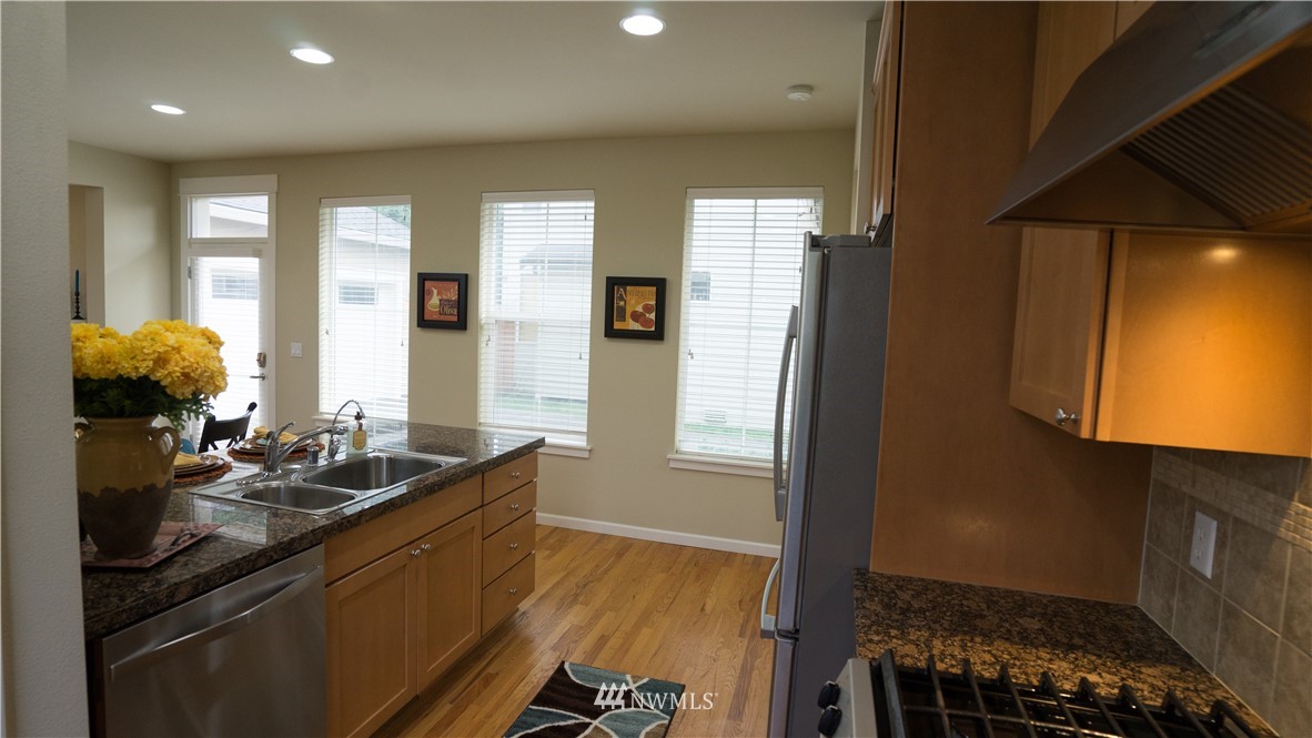 662 Lyons Avenue Northeast Renton, WA 98059 - Photo 11 of 28 a kitchen with sink and window