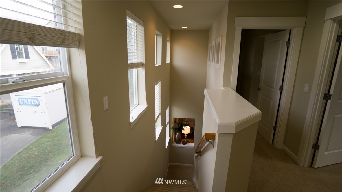 662 Lyons Avenue Northeast Renton, WA 98059 - Photo 17 of 28 a view of a hallway with windows