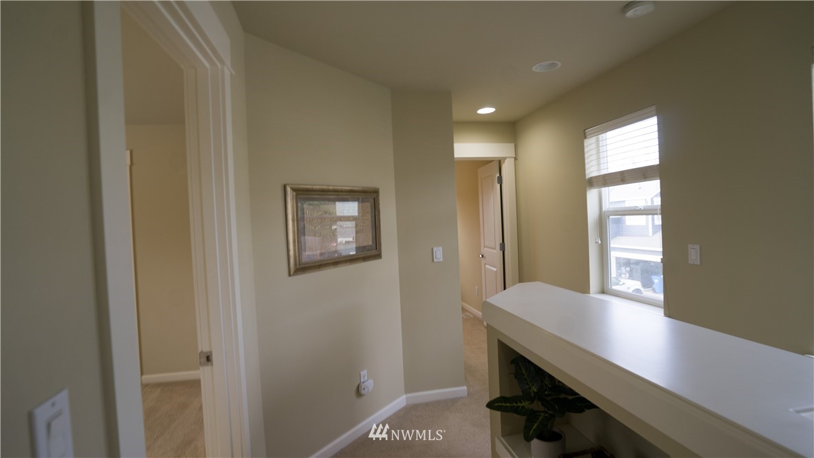 662 Lyons Avenue Northeast Renton, WA 98059 - Photo 18 of 28 a view of a hallway with workspace