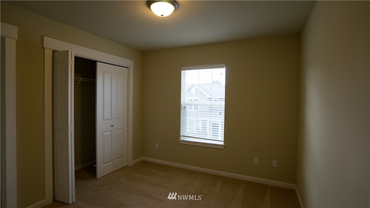 662 Lyons Avenue Northeast Renton, WA 98059 - Photo 19 of 28 an empty room with windows