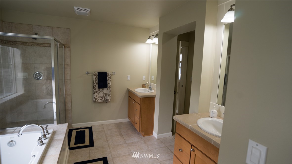 662 Lyons Avenue Northeast Renton, WA 98059 - Photo 24 of 28 a bathroom with a sink a toilet and shower