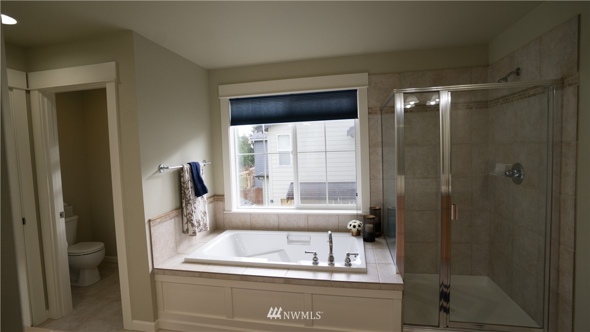 662 Lyons Avenue Northeast Renton, WA 98059 - Photo 25 of 28 a bathroom with a sink and a mirror