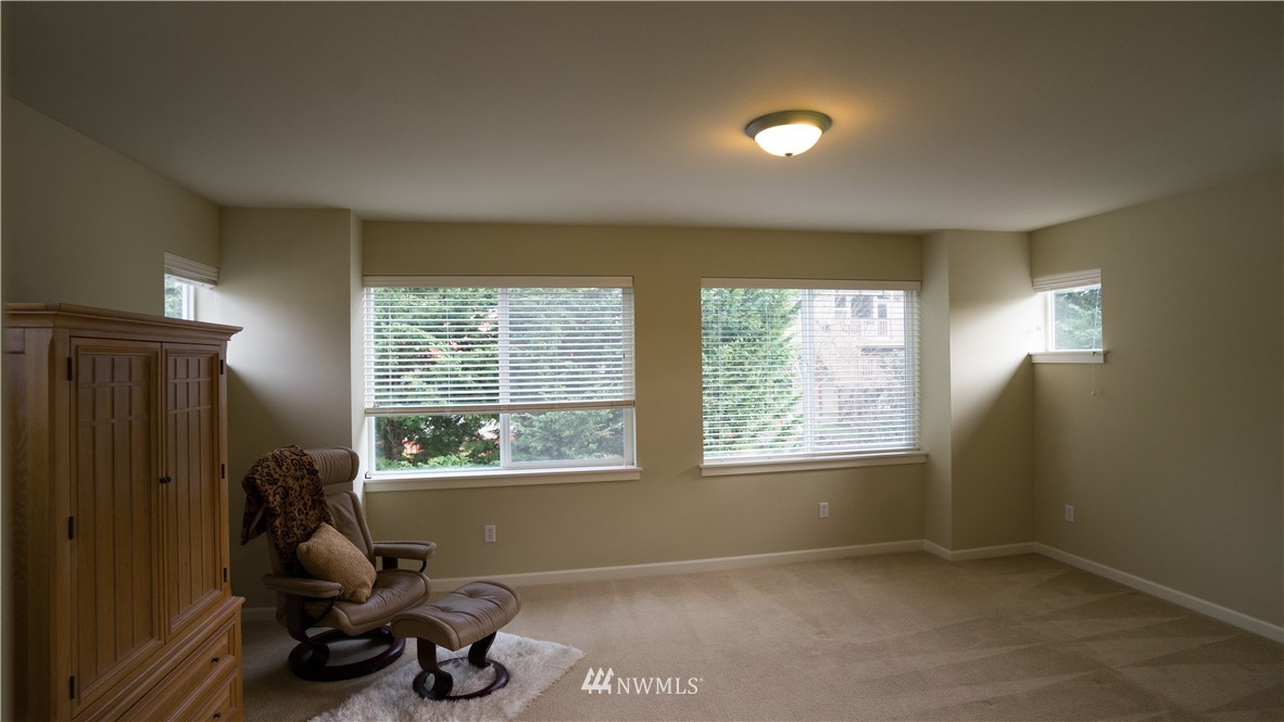 662 Lyons Avenue Northeast Renton, WA 98059 - Photo 27 of 28 a room with furniture and a window