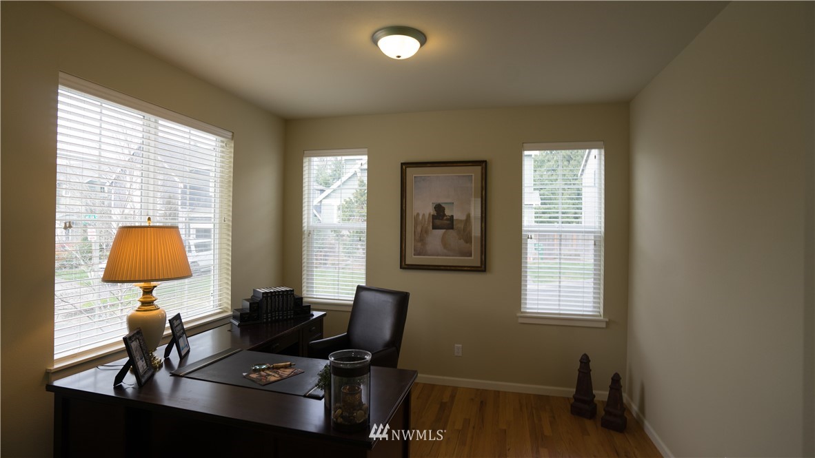 662 Lyons Avenue Northeast Renton, WA 98059 - Photo 4 of 28 a workspace with furniture and a window